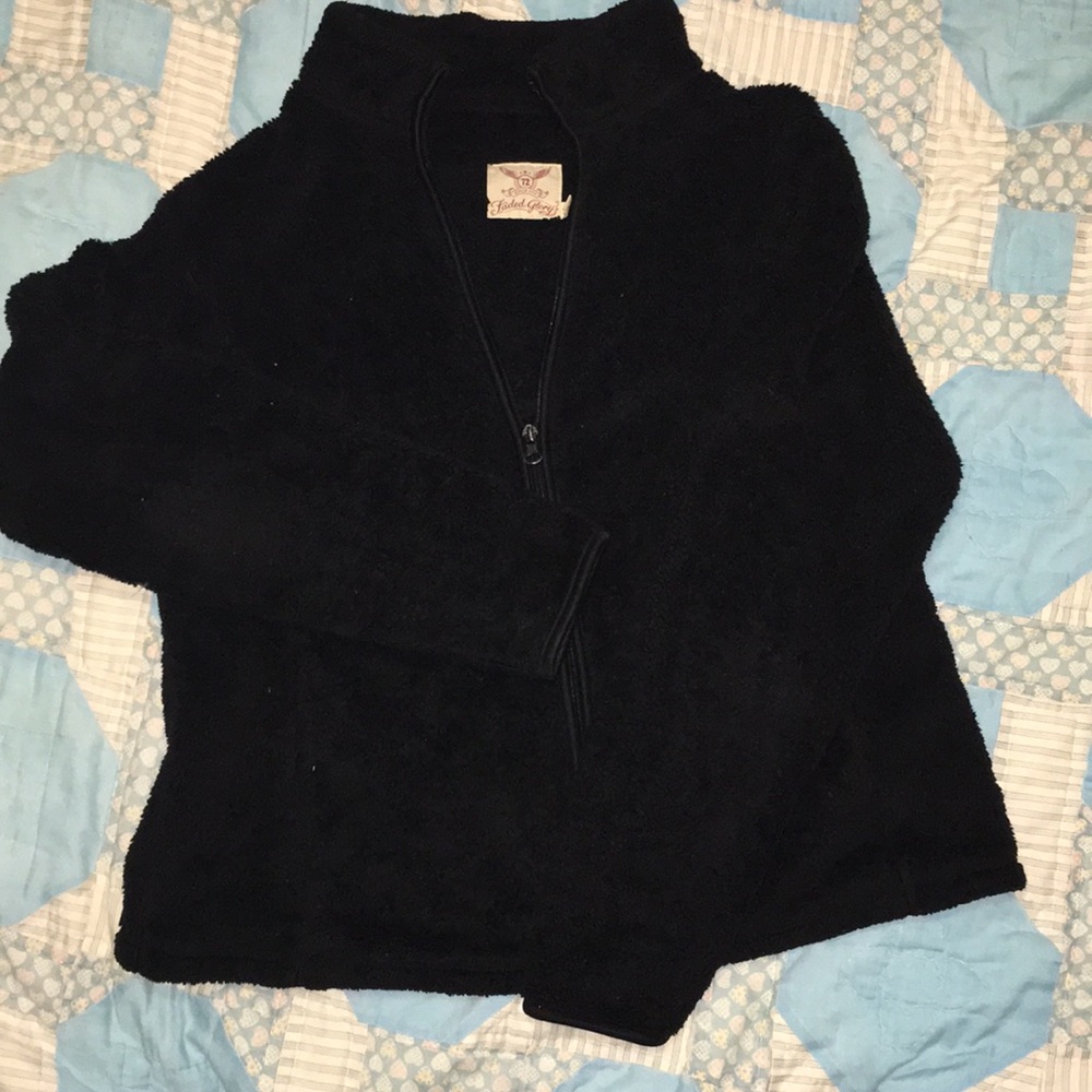 A black faded glory zip up jacket